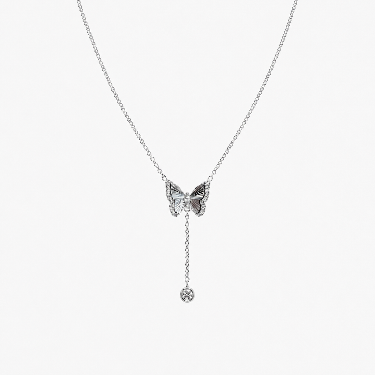 MUTESCENE Charm Bow Lariat styled in silver tone