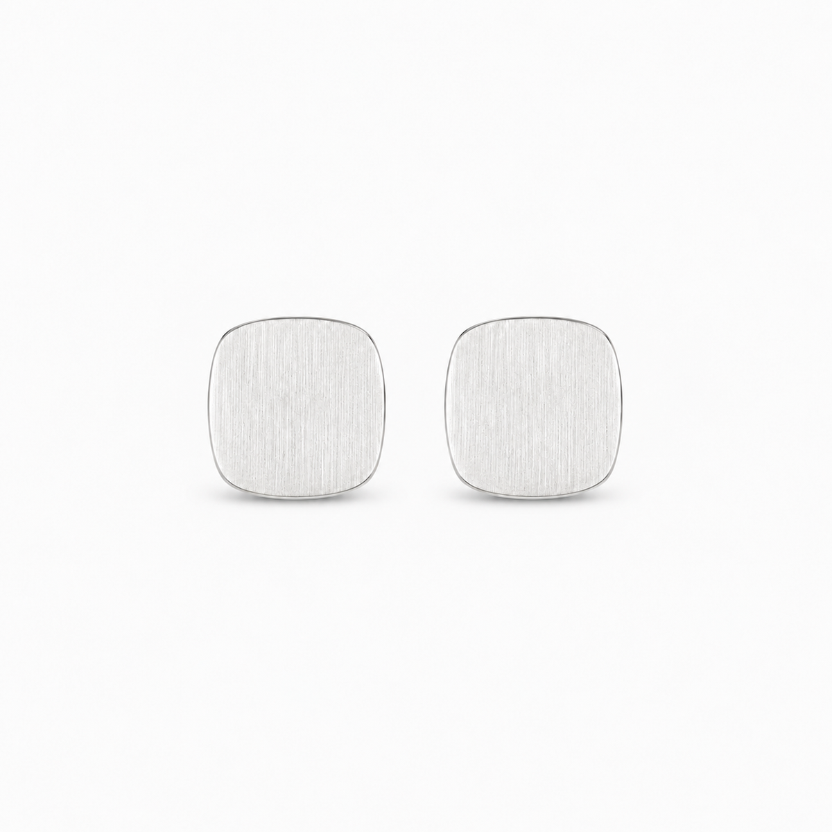 Pause Earrings — light neutral background, collection-safe framing with natural shadow