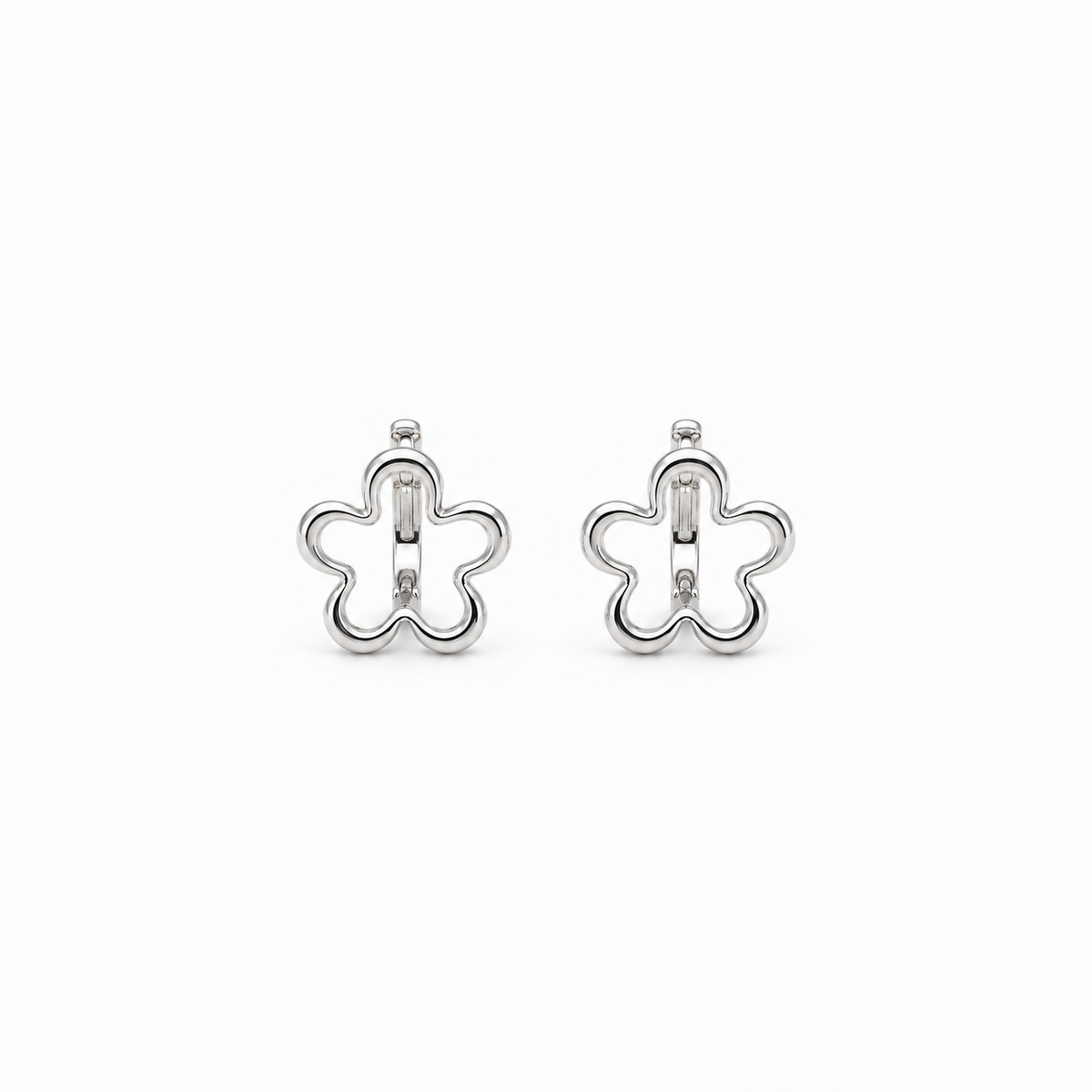 Silent Curve Earrings — light neutral background, collection-safe framing with natural shadow