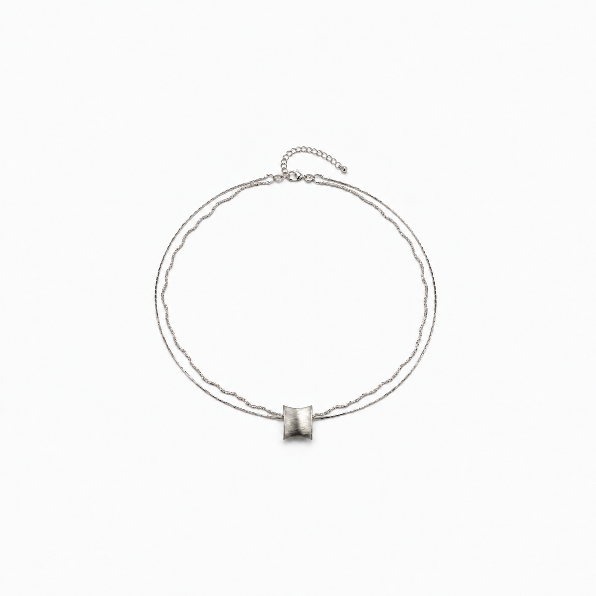 Still Motion Necklace — light neutral background, collection-safe framing with natural shadow