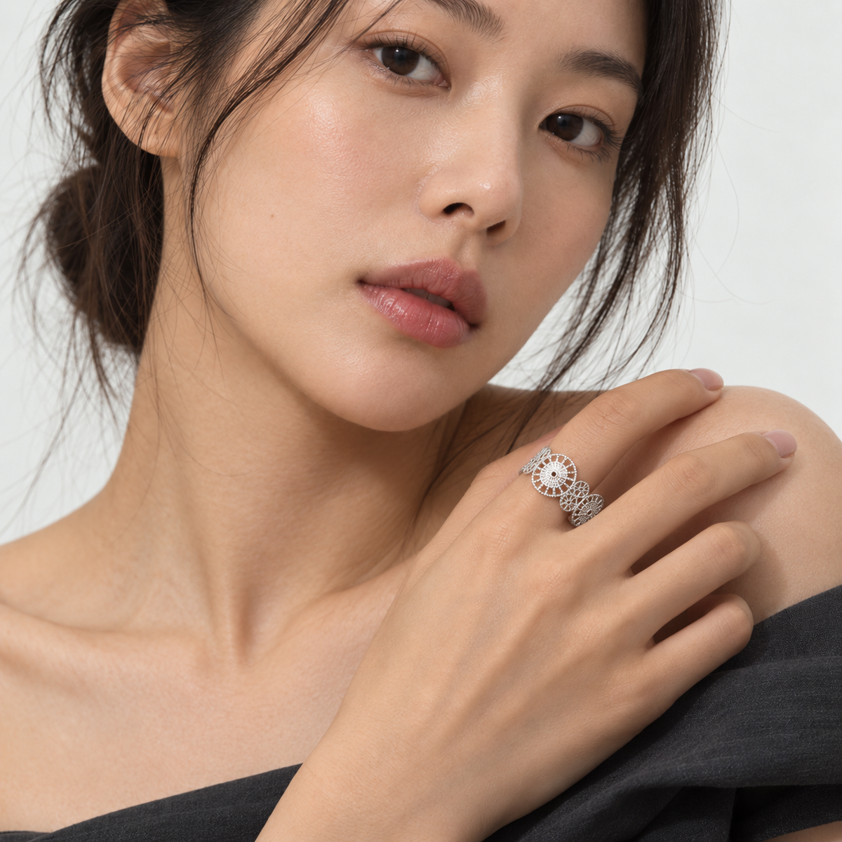 Afterglow Ring — silver filigree worn on hand