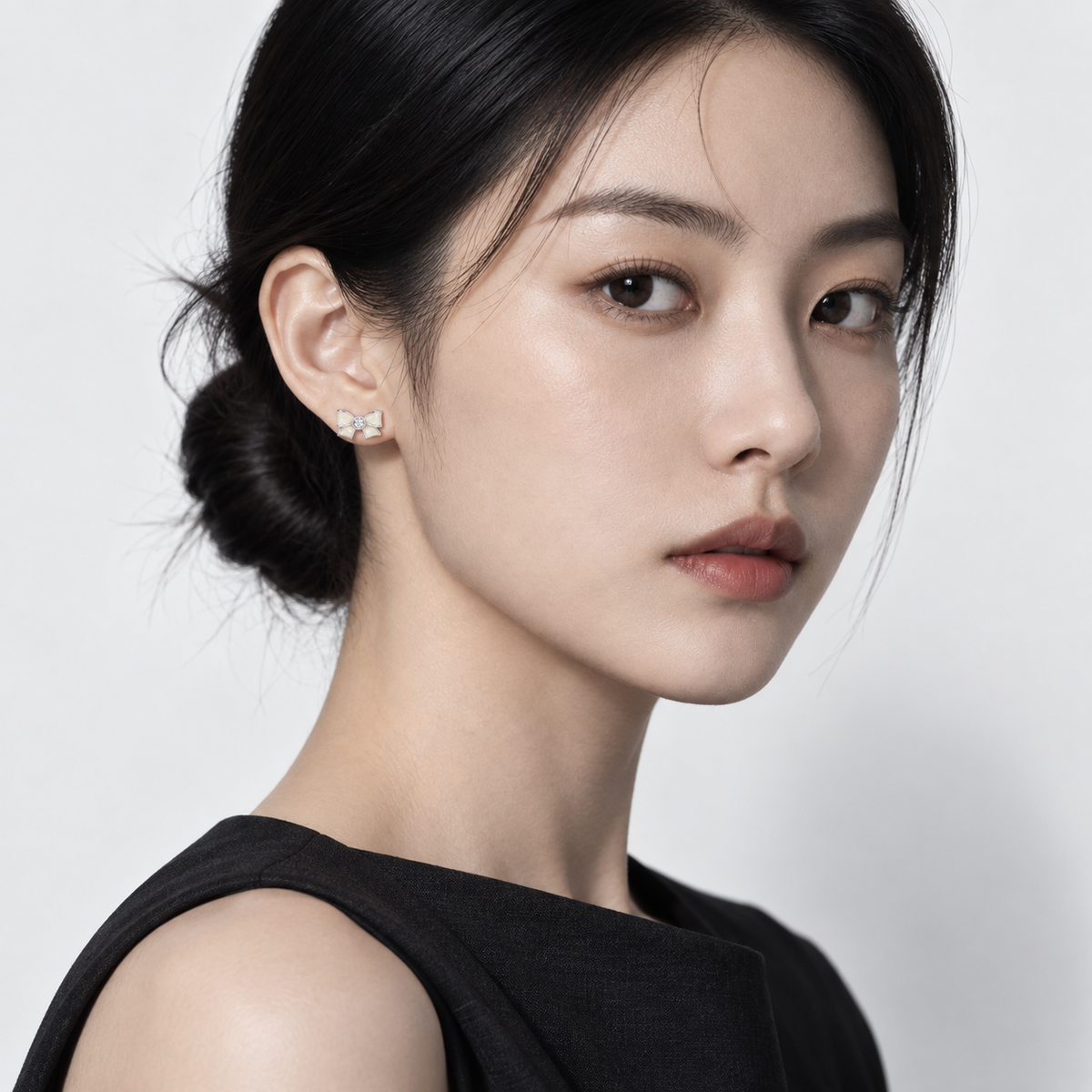 Silver Bow Studs — model wearing view 1